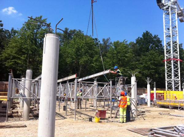 Supporting columns at ground level, early in construction process