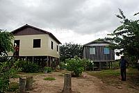 Dona Maria’s new house alongside her old house now lived in by her brother - © Damian Fleming / WWF-UK Dona Maria’s new house alongside her old house now lived in by her brother