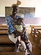 Teacher Adekon Sebastien and her daughter Marie Segolene inside the school building in Malene village, East province, Cameroon Teacher Adekon Sebastien and her daughter Marie Segolene inside the school building in Malene village, East province, Cameroon