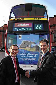 Dan Barlow shakes hands with Iain Coupar, Marketing Director of Lothian Buses
