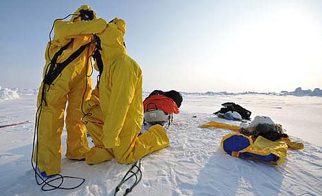 Pen Hadow and Ann Daniels with immersion suits on