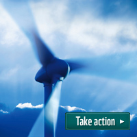 Wind turbine with text 'take action' - ©iStock Wind turbine with text 'take action'