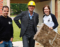 Kevin McCloud - building a sustainable house outside parliament for the Great British Refurb campaign