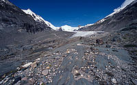 The impressive Pasterze Glacier lies in the Hohe Tauern mountain range of the Alps, along the northeastern slope of Austria's tallest mountain, Grossglockner and flows into the Moell River. The 9 kilometre-long Pasterze is currently losing 5 metres in height and 20 metres in length every year.The retreat of Pasterze is monitored by satellite and is used in many models to estimate the loss of mountain glaciers around the world. 