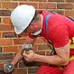 Workman insulating wall © www.nationalinsulationassociation.org.uk