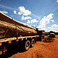 Logging trucks parked alongside the Interoceanica highway. Peru - Brent Stirton / Getty Images / WWF-UK Logging trucks parked alongside the Interoceanica highway. Peru
