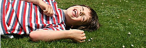 Laughing child lying down