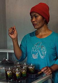 Mrs Dami with cups of coffee