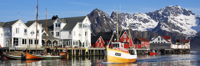 Fishing boat arriving back into port in Henningsvaer, Lofoten Islands, Norway