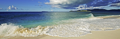 Beach scene and clouds over the ocean. Cousine Island, Seychelles