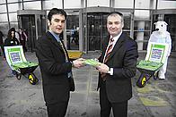 Dan Barlow hands over postcards to Richard Lochhead MSP