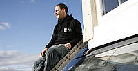 Simon McWhirter on the roof of the sustainable house he is building - WWF-UK Simon McWhirter on the roof of the sustainable house he is building