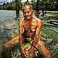 Local man at his family burial site, now submerged in water, Navua, Fiji - © Brent Stirton / Getty Images Local man at his family burial site, now submerged in water, Navua, Fiji