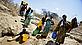 Fetching water, Tanzania - Brent Stirton / Getty Images / WWF-UK Fetching water, Tanzania