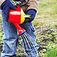 Close-up of child watering plants