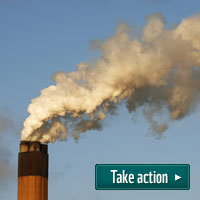 Steam rising from a chimney at a coal fired power station. United Kingdom.