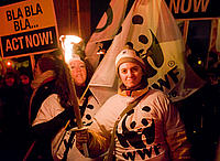 Protesters of WWF-Belgium with candles at the candle light vigil outside the Bella Centre at the end of 