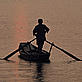 Fisherman at sunset on the flooded Dongting Lake. Hunan Province, China