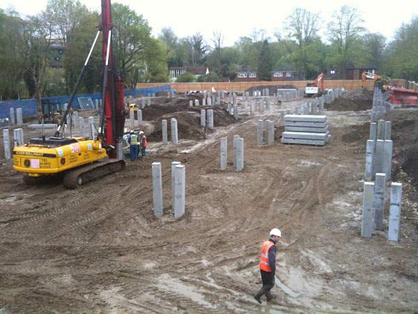 The early construction site, showing driven concrete pile foundations