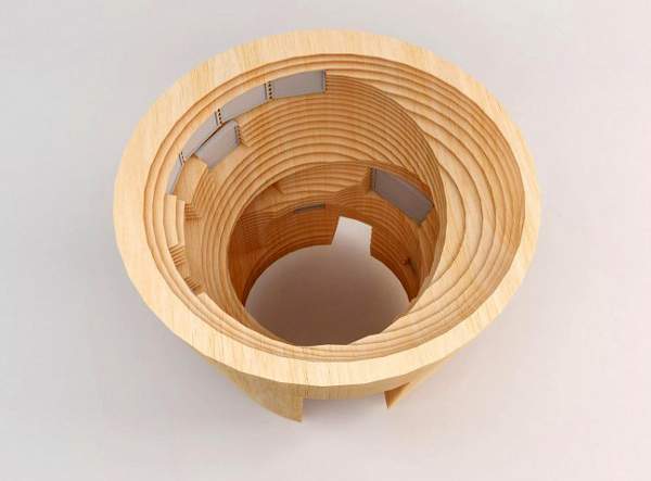 Early carved-wood scale model of the flowerpot-shaped zones designed by Jason Bruges Studio