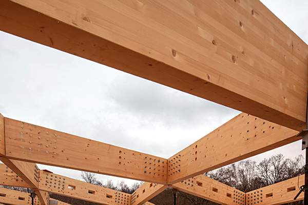 Close-up image of the glulam roof beams, during construction