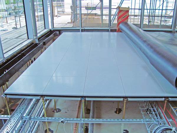 Part of the Mero-Schmidlin raised flooring system being installed